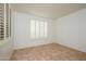 Bright and airy bedroom space with tile floor and shuttered windows at 20113 N Lagos Ct, Surprise, AZ 85374