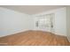 Sunlit bedroom with wood floors and shuttered windows at 20113 N Lagos Ct, Surprise, AZ 85374