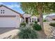 Inviting single-story home with a two-car garage, charming curb appeal, and mature landscaping at 20113 N Lagos Ct, Surprise, AZ 85374