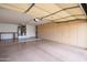 Spacious garage with storage cabinets and door to the house at 20113 N Lagos Ct, Surprise, AZ 85374