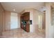Open living space featuring tile floors, wet bar, and a front entry door at 20113 N Lagos Ct, Surprise, AZ 85374