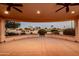 Covered patio with ceiling fans, recessed lighting, and desert landscaping at 20113 N Lagos Ct, Surprise, AZ 85374