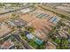 Aerial view of equestrian facility featuring barns, training areas, and residences at 20386 E Bronco Dr, Queen Creek, AZ 85142