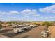 Expansive aerial view showing the property's layout and ample space for RV storage with various amenities at 20386 E Bronco Dr, Queen Creek, AZ 85142