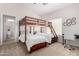 Bright bedroom featuring a bunk bed, desk, and neutral walls at 20386 E Bronco Dr, Queen Creek, AZ 85142