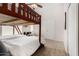 Bright bedroom featuring a bunk bed, study desk, and neutral walls at 20386 E Bronco Dr, Queen Creek, AZ 85142