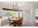 Bright dining area featuring a modern light fixture and large window at 20386 E Bronco Dr, Queen Creek, AZ 85142