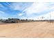 Wide angle view of a horse property with RV parking, covered arena and horse trails at 20386 E Bronco Dr, Queen Creek, AZ 85142
