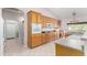 Kitchen with natural wood cabinetry and a view into the breakfast nook at 20386 E Bronco Dr, Queen Creek, AZ 85142