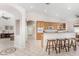 Spacious kitchen featuring natural wood cabinetry and a breakfast bar at 20386 E Bronco Dr, Queen Creek, AZ 85142