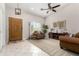 Open concept living room with tiled entryway, vaulted ceilings, and ceiling fan at 20386 E Bronco Dr, Queen Creek, AZ 85142