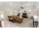 Spacious living room with high ceilings, carpet flooring and modern ceiling fan at 20386 E Bronco Dr, Queen Creek, AZ 85142