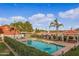 Inviting community pool with a gazebo and lush landscaping at 20386 E Bronco Dr, Queen Creek, AZ 85142