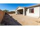 Spacious backyard featuring a covered patio and ample space for customization at 20421 W Legend Trl, Buckeye, AZ 85396