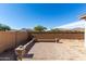 Large backyard with a spacious patio and privacy wall, ideal for outdoor activities at 20421 W Legend Trl, Buckeye, AZ 85396