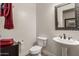 Half bathroom with a pedestal sink and modern finishes at 20421 W Legend Trl, Buckeye, AZ 85396