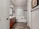 Bathroom with a double vanity, soaking tub, shower and wood-look flooring at 20421 W Legend Trl, Buckeye, AZ 85396