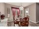 Cozy dining room featuring a wood table and stylish chandelier, perfect for intimate meals at 20421 W Legend Trl, Buckeye, AZ 85396