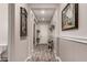 Inviting entryway featuring wood-look tile flooring, neutral walls, and an open layout at 20421 W Legend Trl, Buckeye, AZ 85396