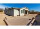 Rear exterior of a single-story home featuring a patio and desert landscaping at 20421 W Legend Trl, Buckeye, AZ 85396