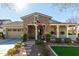 Charming single-story home with stone facade, covered porch, and well-maintained landscaping at 20421 W Legend Trl, Buckeye, AZ 85396