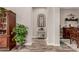 Inviting hallway with wood-look tile flooring and decorative accents leading into the home at 20421 W Legend Trl, Buckeye, AZ 85396