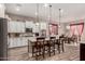 Spacious open concept kitchen with island and adjacent dining area, perfect for entertaining guests at 20421 W Legend Trl, Buckeye, AZ 85396