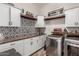 Well-organized laundry room featuring modern appliances and ample storage at 20421 W Legend Trl, Buckeye, AZ 85396