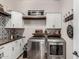 Well-organized laundry room featuring modern appliances and ample storage at 20421 W Legend Trl, Buckeye, AZ 85396