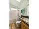 This bathroom has a shower and bathtub combo, toilet, sink and wood style vinyl flooring at 2263 N Trekell Rd # 175, Casa Grande, AZ 85122