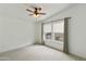 This unfurnished bedroom has carpet, ceiling fan, two windows and curtains at 2263 N Trekell Rd # 175, Casa Grande, AZ 85122