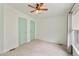 This bedroom has carpet and two doors, one leading to the bedroom closet and another the house at 2263 N Trekell Rd # 175, Casa Grande, AZ 85122