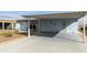 View of the exterior with a covered parking area and landscaped front, showing a light-blue facade at 2263 N Trekell Rd # 175, Casa Grande, AZ 85122