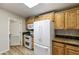 Bright kitchen with wood cabinets, granite countertops, stainless steel appliances, and a convenient skylight at 2263 N Trekell Rd # 175, Casa Grande, AZ 85122