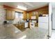 Community kitchen with tile backsplash, modern appliances, and ample counter space at 2263 N Trekell Rd # 175, Casa Grande, AZ 85122