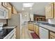 The kitchen is equipped with wood cabinets, granite countertops, and stainless steel appliances at 2263 N Trekell Rd # 175, Casa Grande, AZ 85122