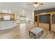 Open living room with wood floors, a ceiling fan, and combined kitchen area at 2263 N Trekell Rd # 175, Casa Grande, AZ 85122