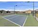 Play a game on the community pickleball court with surrounding homes at 2263 N Trekell Rd # 175, Casa Grande, AZ 85122