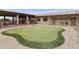 This home community features a putting green for residents to enjoy and practice their putting game at 2263 N Trekell Rd # 175, Casa Grande, AZ 85122