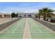 Enjoy community shuffleboard courts with desert landscaping and clear blue skies at 2263 N Trekell Rd # 175, Casa Grande, AZ 85122