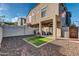 Backyard with covered patio, grill, string lights, rock landscaping and small grass at 2402 E 5Th St # 1455, Tempe, AZ 85288