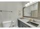 Bathroom featuring granite countertop, framed mirror, toilet, and neutral tones at 2402 E 5Th St # 1455, Tempe, AZ 85288