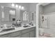 Bathroom featuring double sinks, vanity, and a shower/tub combo at 2402 E 5Th St # 1455, Tempe, AZ 85288
