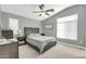 Spacious bedroom featuring a ceiling fan, plush carpeting, and a large window at 2402 E 5Th St # 1455, Tempe, AZ 85288