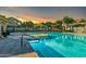 Community pool with a nearby jacuzzi, ample seating, and a gorgeous sunset at 2402 E 5Th St # 1455, Tempe, AZ 85288