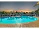 Community pool with ample seating, nearby gazebos, and a gorgeous sunset at 2402 E 5Th St # 1455, Tempe, AZ 85288