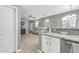 View of the kitchen and living room with an open floor plan and wood flooring at 2402 E 5Th St # 1455, Tempe, AZ 85288