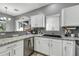 Kitchen with white cabinets, granite countertops, and stainless steel appliances at 2402 E 5Th St # 1455, Tempe, AZ 85288