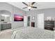 This spacious main bedroom has a ceiling fan, and entry to the en suite bathroom and closet at 2402 E 5Th St # 1455, Tempe, AZ 85288