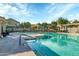 Community pool featuring multiple seating areas, tables and shade at 2402 E 5Th St # 1455, Tempe, AZ 85288